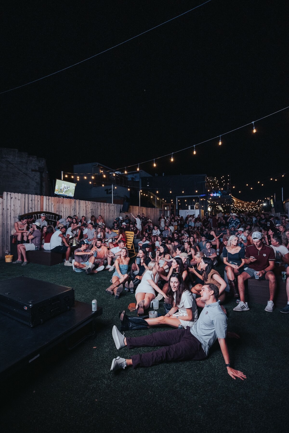 Large group watching a movie at Good Bull