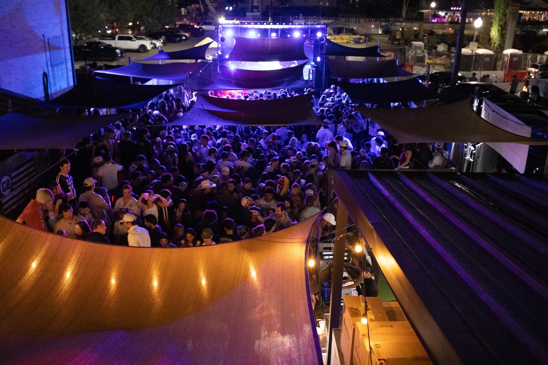 Overhead image of large group at outside stage at Good bull