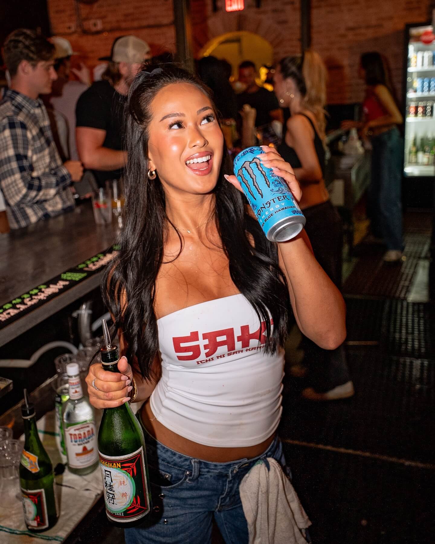 Sake bartender posing with drink