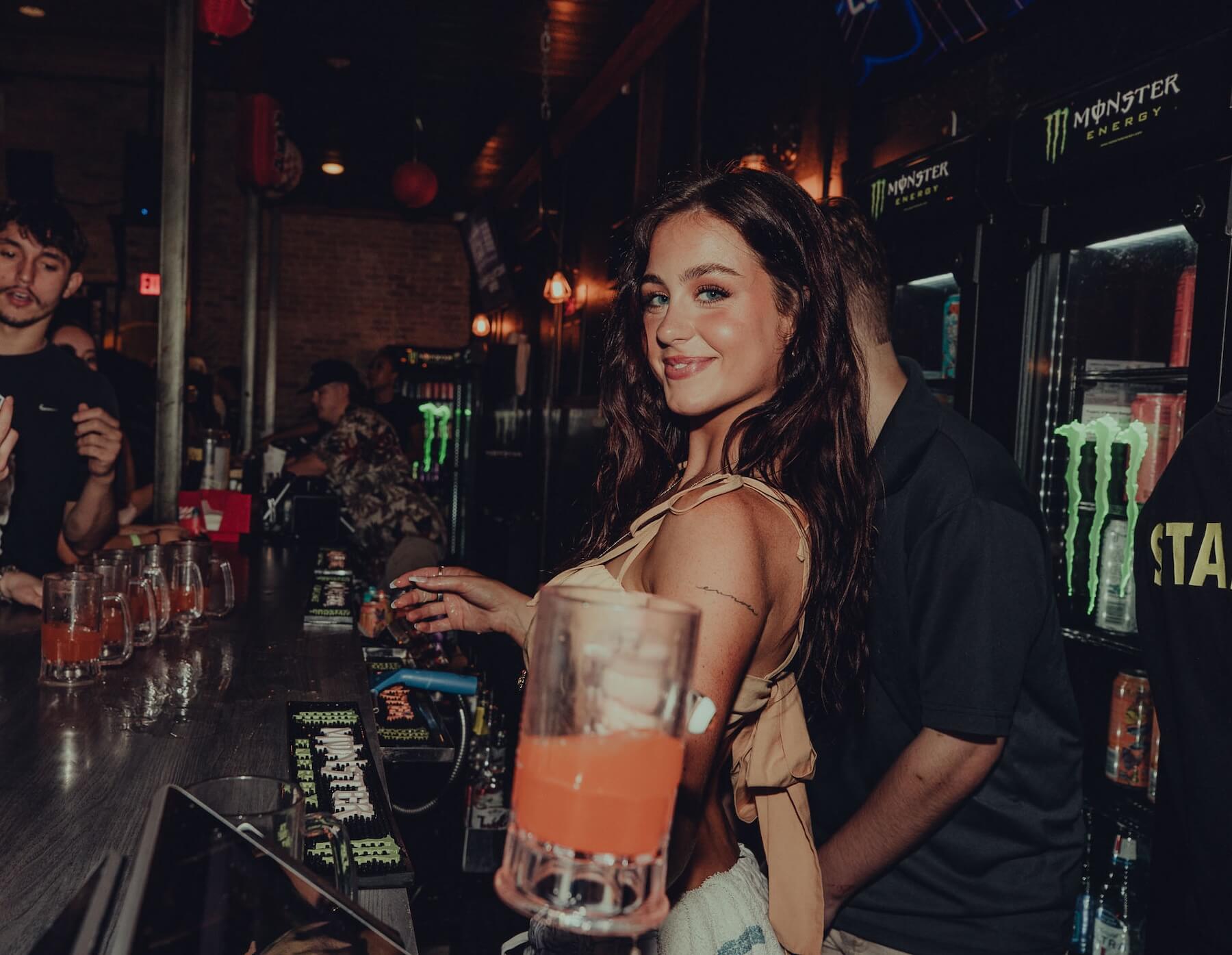 Server handing over a beer